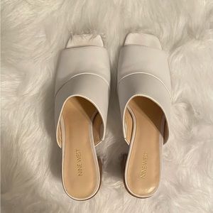Chunky-heeled leather slides in excellent used condition. Size 12M
